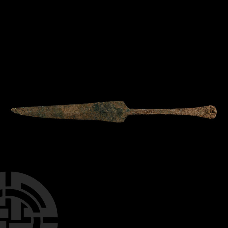 Early 1st millennium B.C.. With tapering triangular blade, having straight shoul...