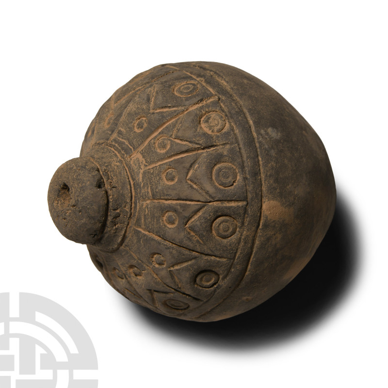 9th-11th century A.D.. Piriform body with domed filler-hole, the upper body divi...