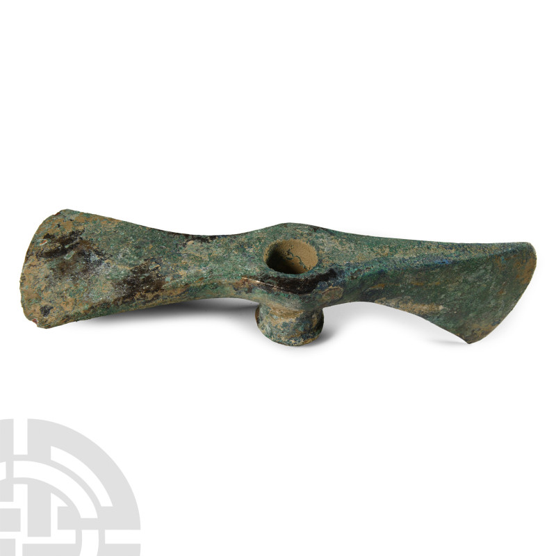 2nd-1st millennium B.C.. With central shaft hole and blade set at right angle. C...