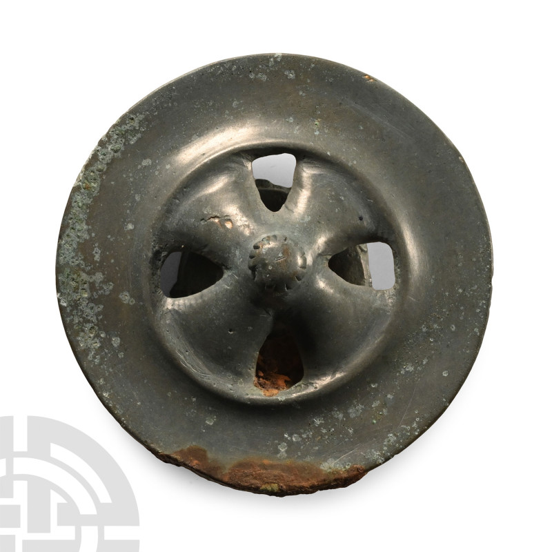 2nd-1st millennium B.C.. Formed as a disc with four flat spokes radiating from a...