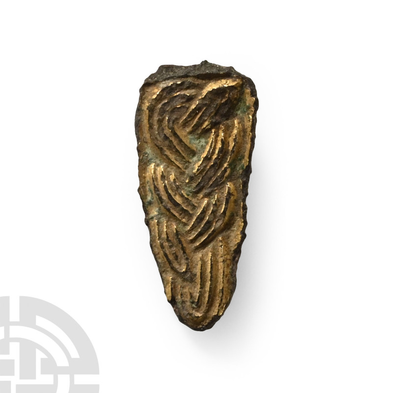 Circa 6th century A.D.. Tongue-shaped plaque with stud to reverse, three-band in...