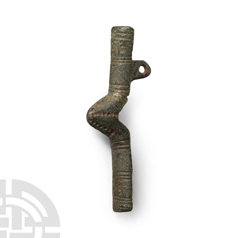 Circa 6th century A.D.. C-shaped in section with transverse hatching and pointil...