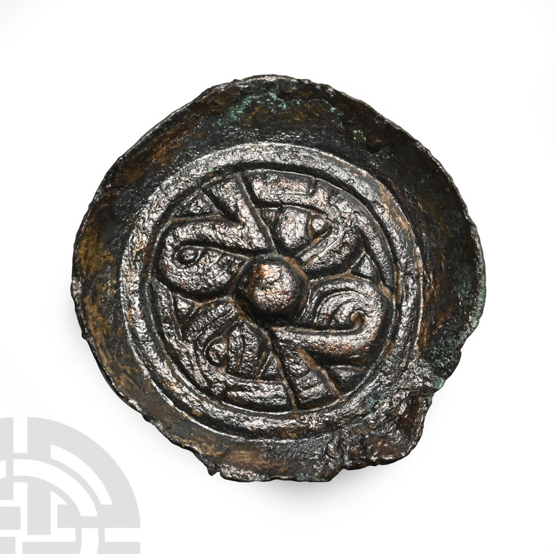 6th century A.D.. With raised flange rim, tondo with raised border and four radi...