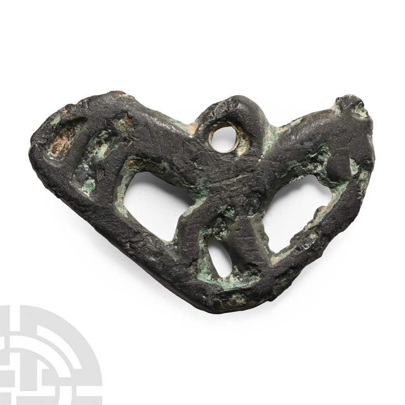 Circa 14th-15th century A.D.. Openwork pendant of an advancing horse on a curved...