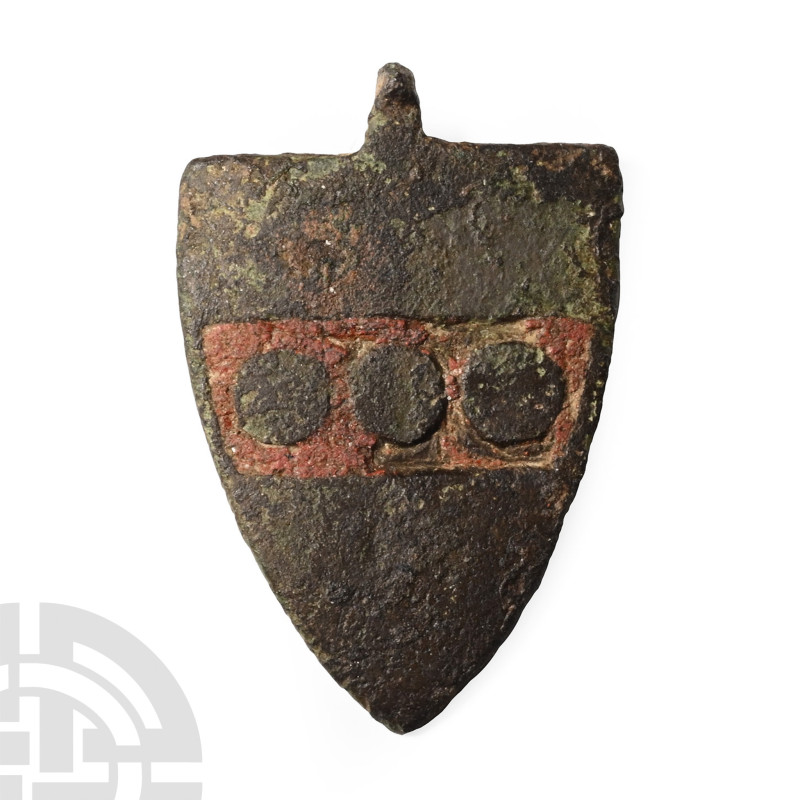 13th-14th century A.D.. Shield-shaped and inlaid with enamel, Or/Argent on a fes...