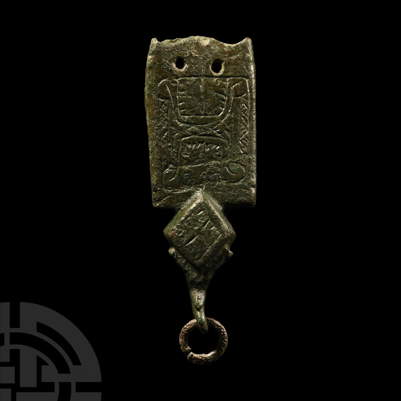 13th-14th century A.D.. Hollow-formed rectangular strap-end with lozengiform blo...