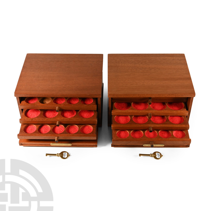 20th century A.D.. Matched pair of miniature coin cabinets, each with brass lock...