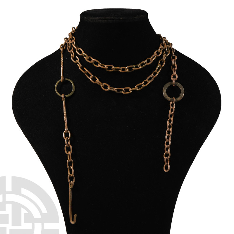 16th century A.D.. Long chain of ellipsoid link with central ring and two string...