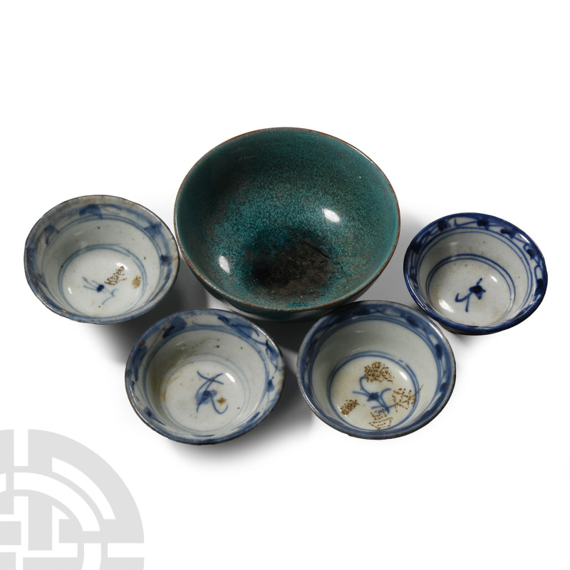 20th century A.D.. Comprising a broad squat turquoise-coloured bowl and four sma...