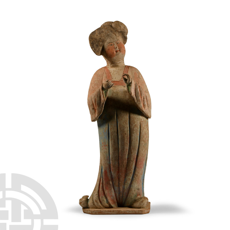 Tang Dynasty, 618-907 A.D.. Standing on a polygonal base, elaborately dressed ha...