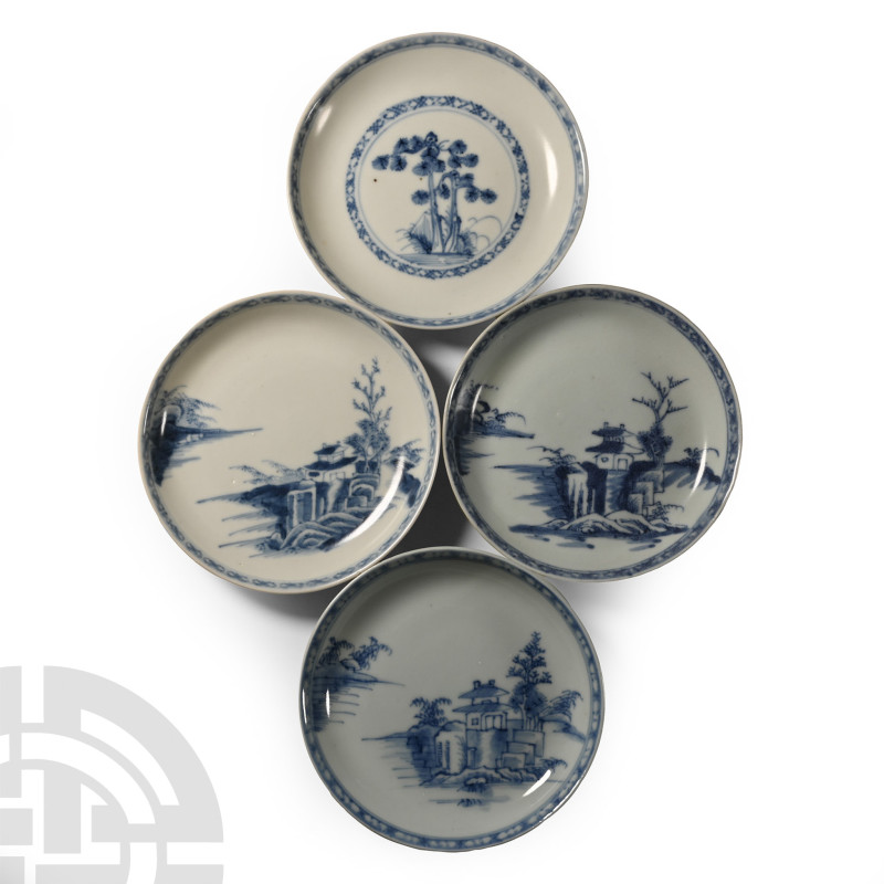 Early 18th century A.D.. Comprising four shallow plates, three with a house on a...