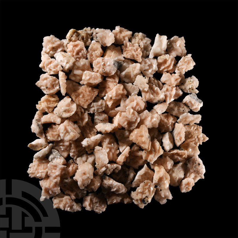 Comprising small and larger pieces of pink dolomite, some with small pyrite crys...