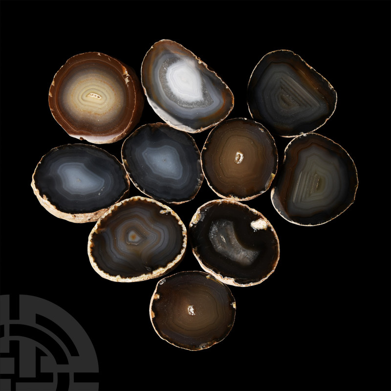 Comprising ten polished halves showing grey and brown banding. 1.06 kg total, 49...