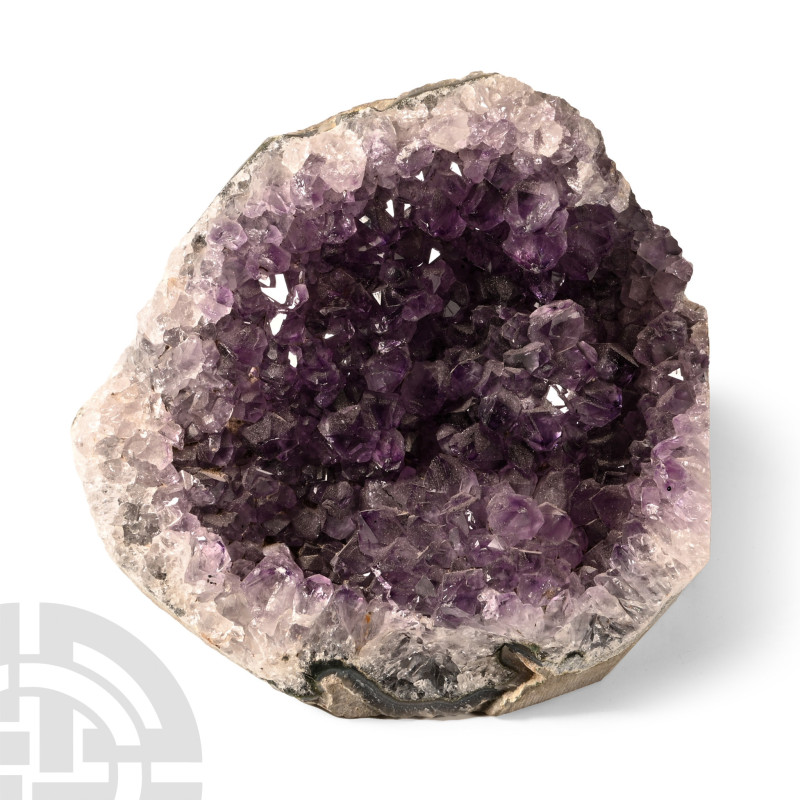 A freestanding cut geode section with lilac-coloured amethyst crystals. 960 gram...