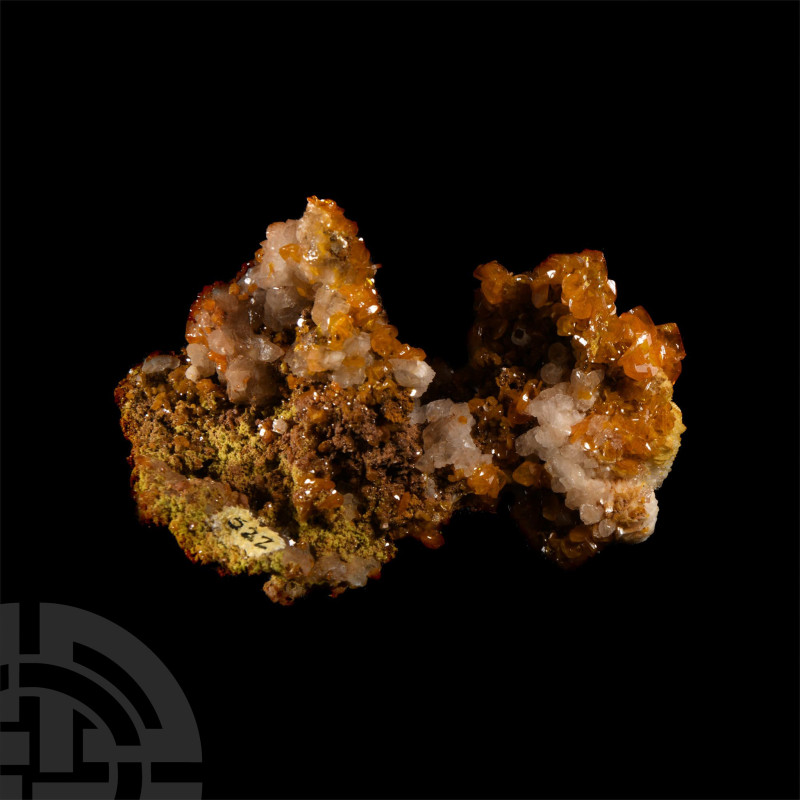 Well-formed toffee-coloured wulfenite crystals with a small area of pale lemon-y...