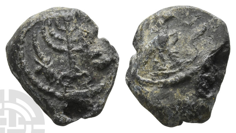 Judaea, Lead Seal. 4th-5th century AD. Menorah on tripod base flanked by lulav a...