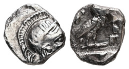 Attica, Athens. AR, Obol. 0.71 g. - 9.41 mm. Circa 454-404 BC.
Obv.: Head of Athena right, with frontal eye; wearing crested Attic helmet decorated wi...