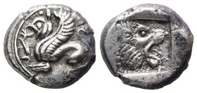 Troas, Assos. AR Drachm, 3.86 g 15.00 mm. Circa 500-450 BC.
Obv: Griffin seated left; tongue out.
Rev: Lion head right, prominent teeth and tongue out...