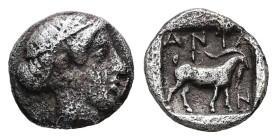 Troas, Antandros. AR Obol, 0.50 g 8.21 mm. Circa 360-350 BC.
Obv: Head of Artemis Astyrene right.
Rev: ANTA / N, Goat standing right within incuse squ...