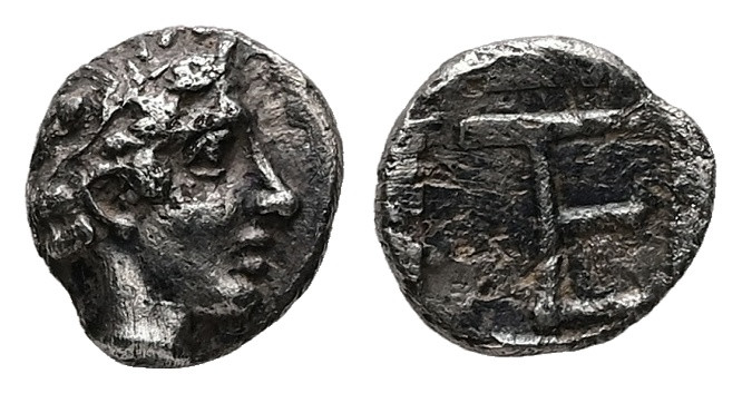 Ionia, Kolophon. AR Tetartemorion, 0.30 g 6.86 mm. Circa 450-410 BC.
Obv: Laurea...