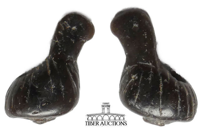 Near East. Circa 1st Millennium BC. Amulet. Black steatite. Seated bird. 17 mm x...