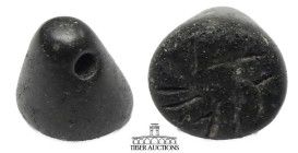 Near East. Circa 2nd -1st Millennium BC. Stamp seal with geometric design. Black steatite. 22 mm x 7 mm. 2.29 g.