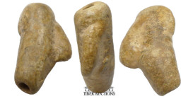 Near East. Circa 3rd-2nd Millennium BC. Amulet, stylized head of a man with large nose. Limestone. 35 mm x 20 mm x 12 mm. 8.19 g.