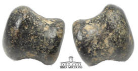 Near East. Circa 1st Millennium BC. Ear stud. Black steatite. 15 mm x 12 mm. 4.85 g.