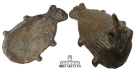 Luristan. Circa 1000-650 BC. Applique, in the form of a bird eating a fish. Cast bronze. 45 mm x 25 mm x 20 mm. 21.96 g.