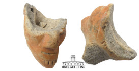 Pre-Columbian. Unknown origin. Circa 600 BC-AD 1200. Head fragment. Terracotta. 30 mm x 40 mm. 19.55 g.