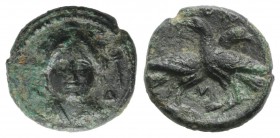 Bruttium, Laos, c. 350-300 BC. Æ (14mm, 2.84g, 12h). Female head facing (Demeter?); Λ-Δ flanking; club to r. R/ Two birds crossing paths; M below. HNI...