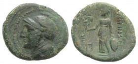Bruttium, Rhegion, c. 215-150 BC. Æ (23mm, 5.27g, 6h). Head of Athena l., wearing helmet decorated with griffin. R/ Athena Nikephoros standing l.; thu...