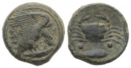 Sicily, Akragas, c. 415-406 BC. Æ Hexas (18mm, 6.46g, 11h). Eagle, with head lowered, standing r. on fish. R/ Crab; fish r. below; two pellets on eith...