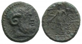 Sicily, Katane, c. 2nd century BC. Æ (21mm, 8.76g, 12h). Laureate head of Zeus Ammon r. R/ Dikaiosyne standing l., holding scales and cornucopia; mono...