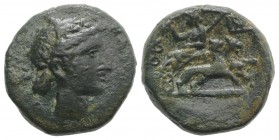 Sicily, Katane, c. 200-187 BC. Æ (20mm, 8.76g, 12h). Head of Dionysos r., wearing ivy wreath. R/ Dionysos, holding kantharos and thyrsos, reclining l....