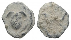 Roman PB Tessera, c. 1st century BC - 1st century AD (12mm, 1.94g, 3h). Winged head of Medusa facing. R/ Starfish(?). Cf. Rostowzew 2633. VF / Good Fi...