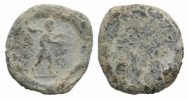 Roman PB Tessera, c. 1st century BC - 1st century AD (21mm, 6.79g). Male advancing r., carrying shovel(?) over shoulder. R/ Uncertain. Good Fine