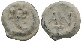Roman PB Tessera, c. 1st century BC - 1st century AD (22mm, 9.57g, 11h). AN/T. R/ Filleted cornucopia. VF
