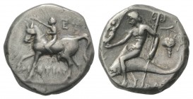 Southern Apulia, Tarentum, c. 272-240 BC. AR Nomos (19mm, 6.26g, 3h). Youth on horseback l., crowning horse with wreath; EY behind, TIΣTIAP below. R/ ...