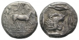 Sicily, Leontini, c. 476-466 BC. AR Tetradrachm (23mm, 17.28g, 5h). Charioteer driving fast quadriga r.; above, Nike flying r., crowning horses. R/ He...