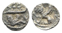 Phoenicia, Byblos. Uncertain king, c. 410-404 BC. AR 1/32 Shekel (6.5mm, 0.25g, 8h). Galley with two hoplites l.; below, hippocamp l. R/ Griffin seate...