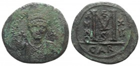 Justinian I (527-565). Æ 40 Nummi (37mm, 23.48g, 12h). Carthage, year 12 (538/9). Helmeted and cuirassed bust facing, holding globus cruciger and shie...