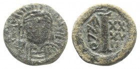 Justinian I (527-565). Æ 10 Nummi (14mm, 4.00g, 6h). Ravenna, year 37 (563/4). Diademed, helmeted and cuirassed facing bust, holding globus cruciger a...