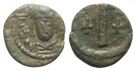 Tiberius II (578-582). Æ 10 Nummi (15mm, 3.44g). Ravenna. Helmeted and cuirassed facing bust, holding globus cruciger and shield. R/ Large I; crosses ...
