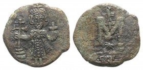 Justinian II (First reign, 685-695). Æ 40 Nummi (20mm, 4.42g, 6h). Syracuse, 687-689. Justinian standing facing, holding cross potent on steps and glo...