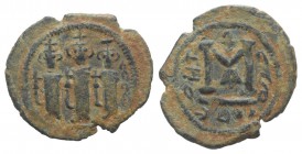 Islamic, Arab-Byzantine, c. 685-700. Æ Fals (22mm, 3.44g, 3h). Tabariya. Three figures standing facing. R/ Anchor above large M, officina A. Album 351...