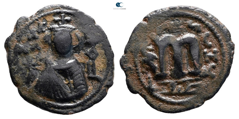 Arab-Byzantine . Hims (Emesa) mint. Abd al-Malik ibn Marwan AH 65-86. 
Æ Fals
...