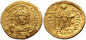 Justinian I (527-565) AV Solidus (Gold, 4.45g, 20mm) Constantinople, 545-565. 
Obv: D N IVSTINIANVS P P AVC, helmeted and cuirassed bust facing, holdi...