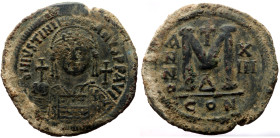 Justinian I (527-565) AE Follis (Bronze, 24.79g, 41mm) Constantinople
Obv: D N IVSTINIANVS P P AVG, helmeted and cuirassed bust facing, holding globus...
