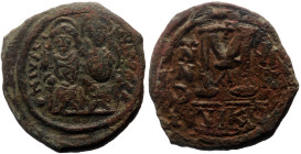 Justin II, with Sophia (565-578) AE Follis (Bronze, 10.69g, 30mm) Nicomedia Dated RY 8 (572/3).
Obv: Nimbate figures of Justin, holding globus crucig...